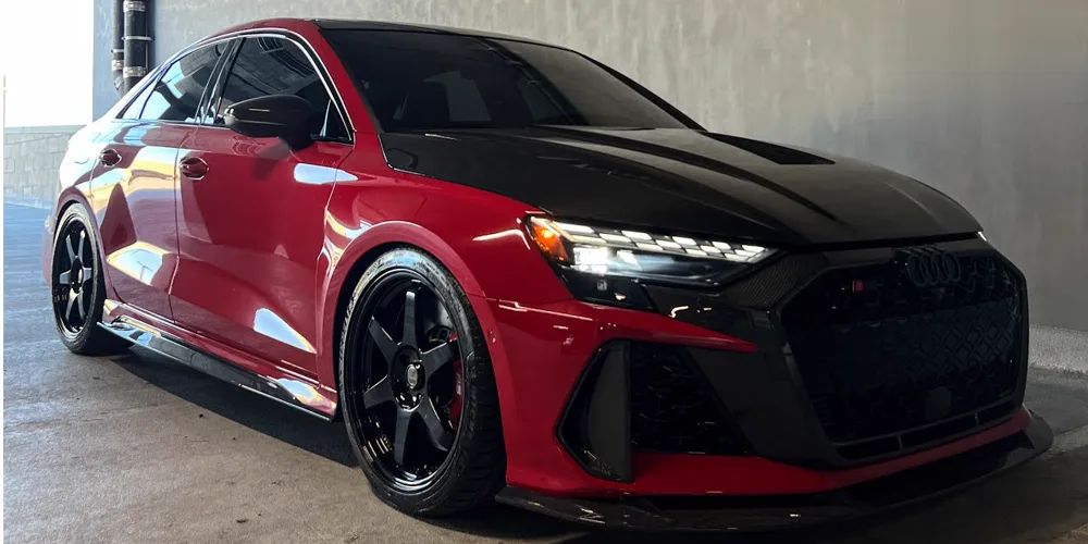 Red Audi RS3 with a black hood